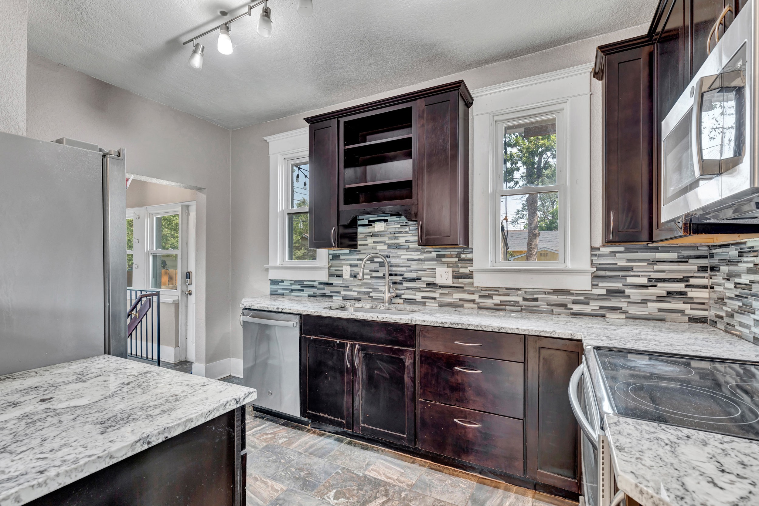 Renovated kitchen with granite counters