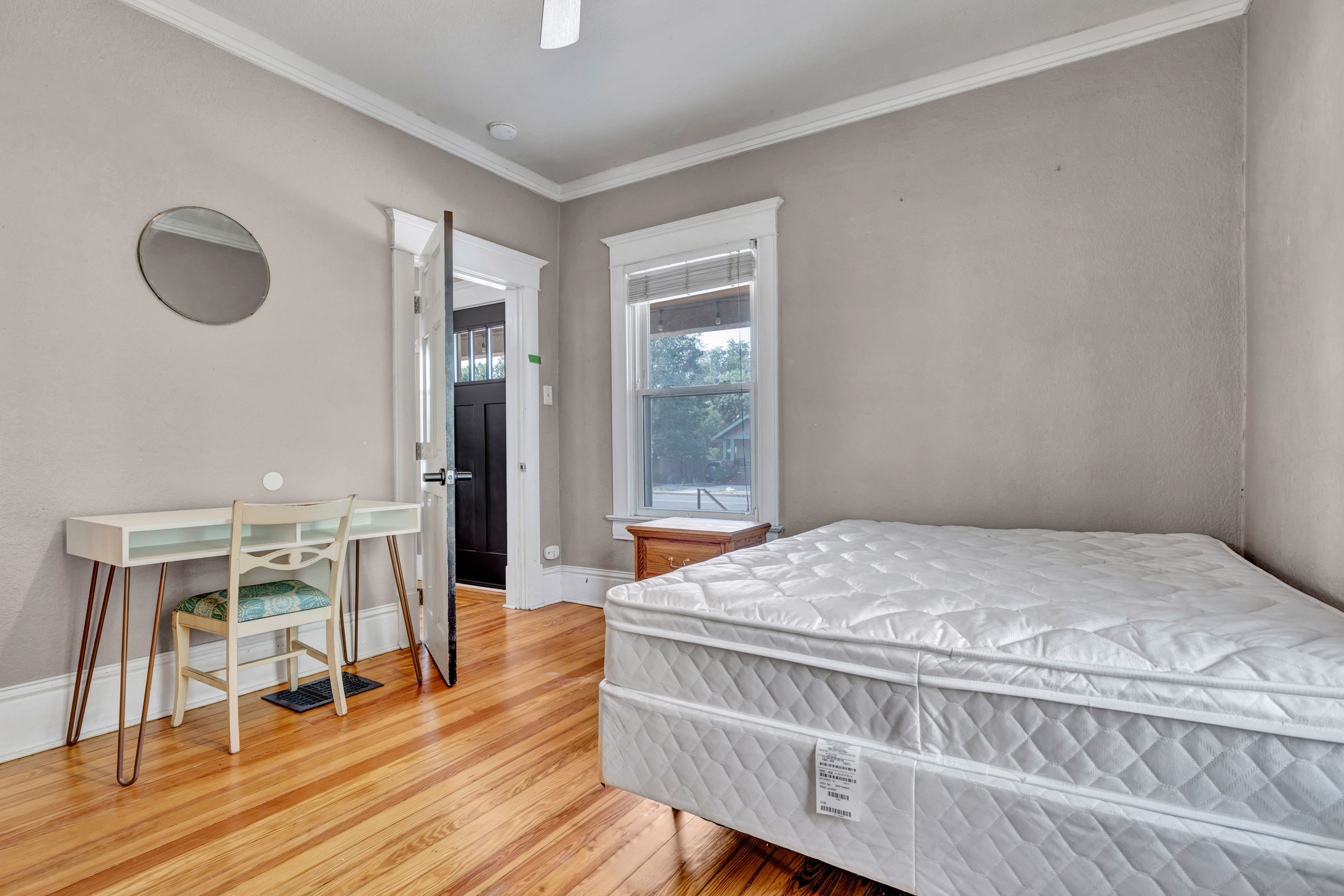 Furnished bedroom with desk