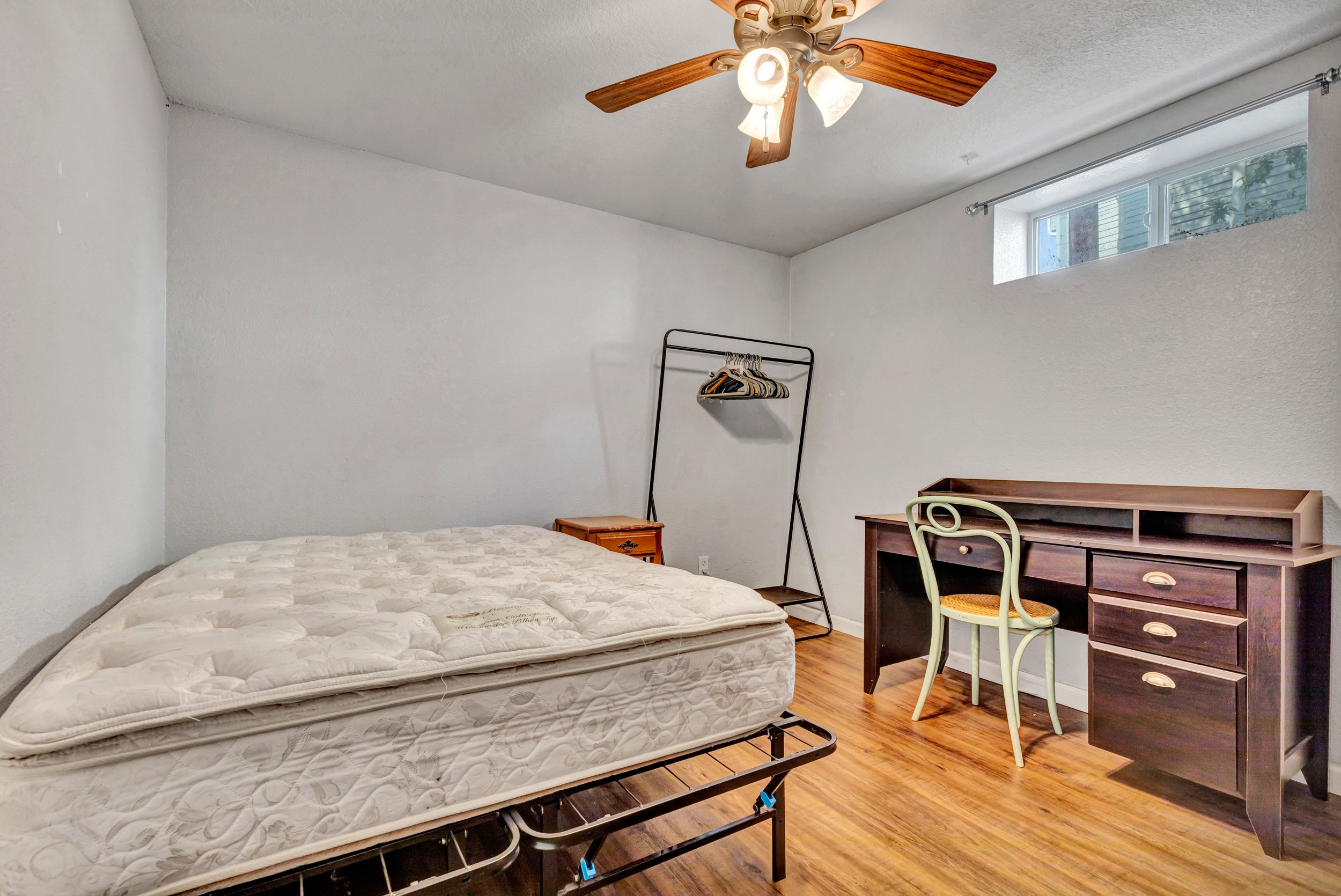 Lower-level bedroom with study desk